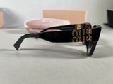 chanel sunglasses in black with gold logo on the side
