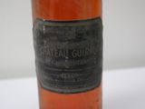 a close up of a bottle of wine on a table