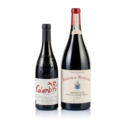 two bottles of wine sitting next to each other on a white surface