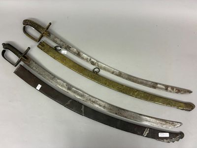 three old swords are sitting side by side on a white surface