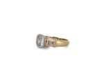 an image of a diamond and gold ring on a white background