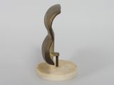 bronze sculpture of a curved curve on a marble base