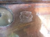 a close up of a metal object with a clock on it