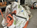 a pile of garbage in a garage with a hose