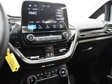 the interior of a car with a steering wheel and dashboard controls