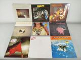 a lot of records on a table with a white background