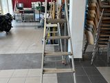 a ladder that is leaning against a wall in a room