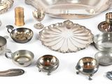 a lot of silver items that are on the table