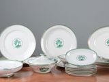 a lot of plates and bowls on the table