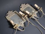 two wall sconces that are attached to the wall