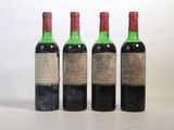trois bouteilles de vin sont posées les unes à côté des autres sur une surface blanche