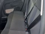 the back seat of a car with a black seat belt