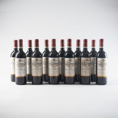 six bottles of red wine lined up in a row