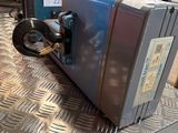 an image of a piece of luggage sitting on a metal table