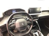 the interior of a car with a steering wheel and dashboard controls