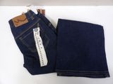 two pairs of blue jeans with a tag on them on a white surface