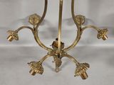 an image of a gold plated candle holder with flowers on it
