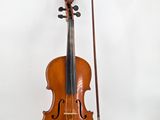 an old violin with a bow and bow rest on a white background