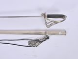 two swords that are laying on a white surface