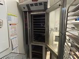 an image of a commercial kitchen with stainless steel racks