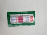 a tube of toothpaste sitting on top of a package of toothpaste