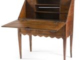 an old wooden desk with a drawer on top of it