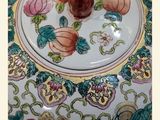 a picture of a decorative bowl with a rose on it