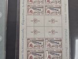 a picture of a set of four stamps on a table