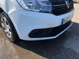 a white car parked on the side of the road