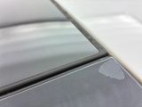 a close up of a cell phone with a broken screen