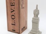 the statue is next to a box with a statue on it