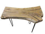 a wooden table with hairpin legs on a white background