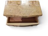 a marble table with a drawer on top of it