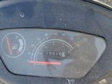 a close up of a speedometer on the dashboard of a motorcycle