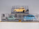 two toy cars in a clear box on a table