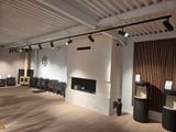 an image of a large room with a fireplace and speakers