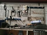many tools hanging on the wall in the garage