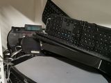 a keyboard and a mouse sitting on top of a shelf