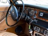 a car dashboard with a steering wheel and a dash board