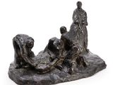 statue représentant un homme et une femme assis sur un rocher, accompagnés d'un chien
