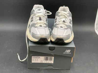 new balance shoes in box with price tag on the side