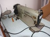 a sewing machine that is sitting on a table