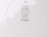 an image of a white plate with a stamp on it