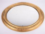 an image of a gold framed mirror on a white surface