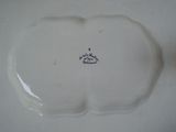 a white plate with a blue and white design on it
