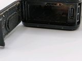 a close up of a cell phone with a broken battery