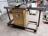 a machine that is sitting on a cart in a factory
