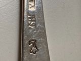a close up of a spoon and a fork on a table