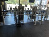 a gym room with a lot of machines in it