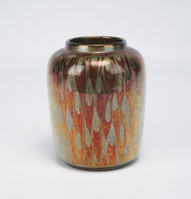 a vase that is sitting on a white surface